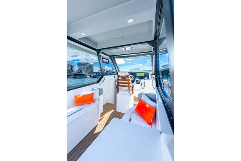  Yacht Photos Pics Interior of 2026 Hammer Yachts 35HH, featuring modern design and vibrant cushions.