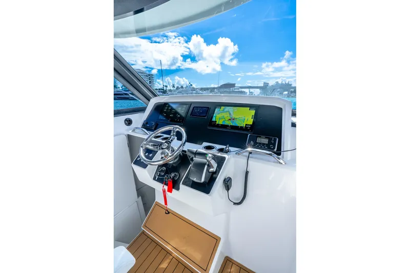  Yacht Photos Pics Helm of 2026 Hammer Yachts 35HH with modern navigation equipment and steering wheel.