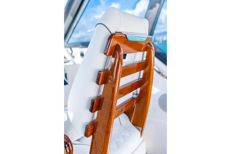  Yacht Photos Pics Luxurious wooden seat detail on 2026 Hammer Yachts 35HH, showcasing elegant craftsmanship.