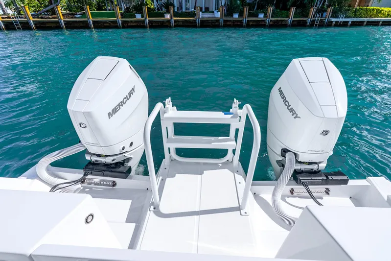  Yacht Photos Pics 2026 Hammer Yachts 35HH with dual Mercury outboard engines on clear blue water.