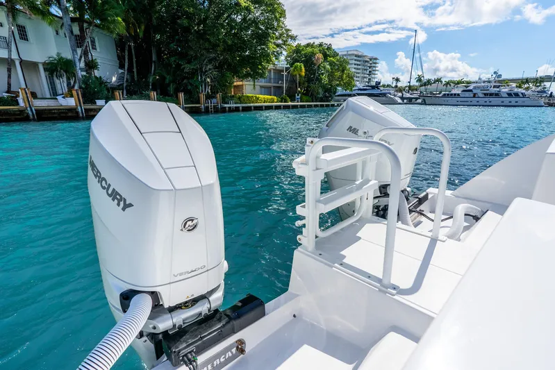  Yacht Photos Pics 2026 Hammer Yachts 35HH with Mercury outboard engines on a sunny waterfront.