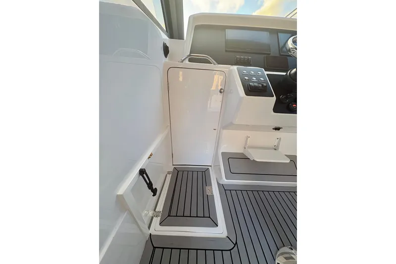  Yacht Photos Pics Interior view of 2026 Hammer Yachts 35HH cockpit with modern controls and sleek design.
