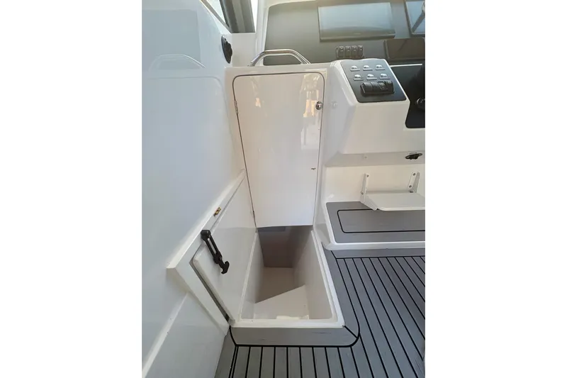  Yacht Photos Pics 2026 Hammer Yachts 35HH interior with storage compartment and control panel.