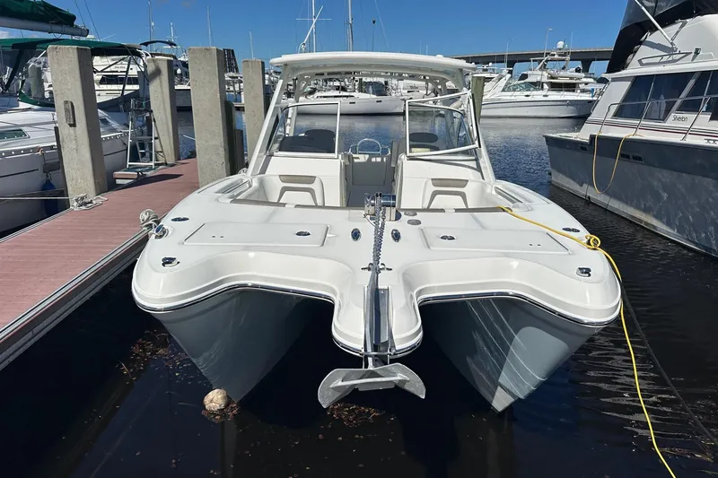 World Cat 296 Dc Yacht Photos Pics 2020 World Cat 296 DC boat docked in marina, front view.