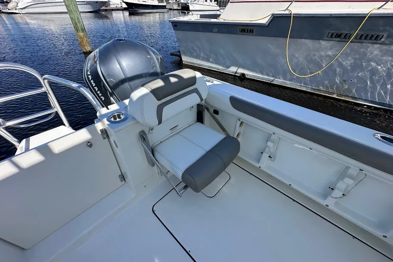 World Cat 296 Dc Yacht Photos Pics 2020 World Cat 296 DC boat interior with Yamaha engine, docked at marina.