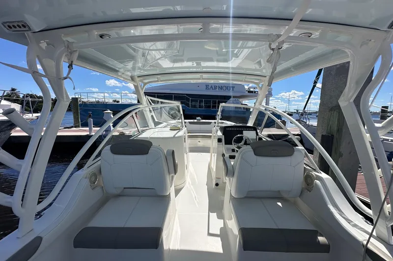 World Cat 296 Dc Yacht Photos Pics 2020 World Cat 296 DC boat interior with seating and helm at marina.