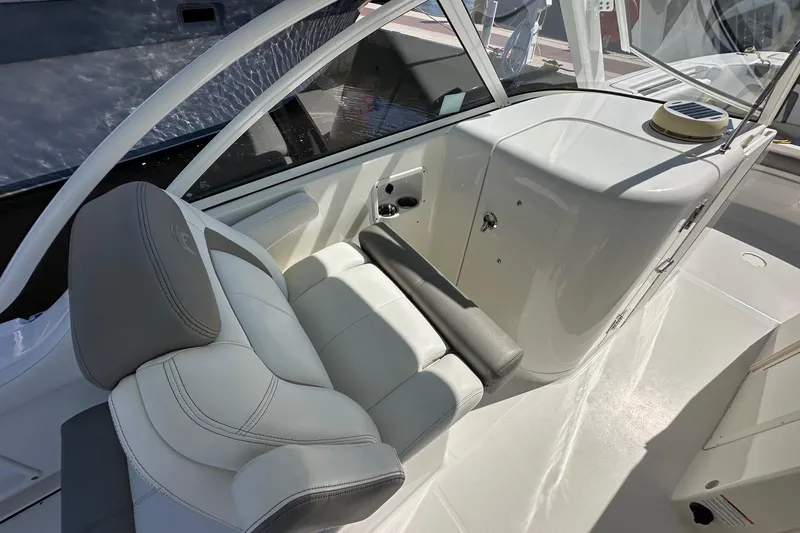 World Cat 296 Dc Yacht Photos Pics 2020 World Cat 296 DC boat interior with white seating and sleek design.