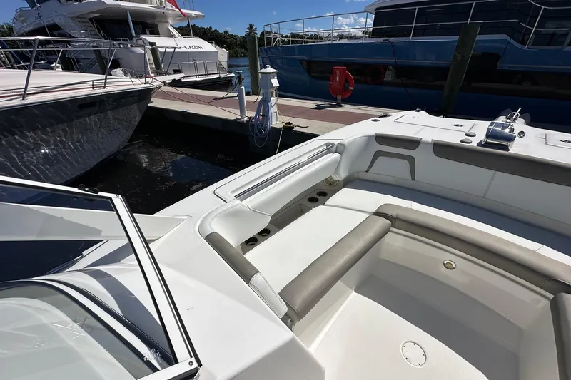 World Cat 296 Dc Yacht Photos Pics 2020 World Cat 296 DC boat interior at marina, featuring spacious seating and sleek design.