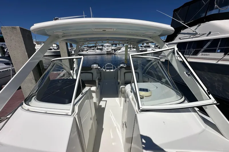 World Cat 296 Dc Yacht Photos Pics 2020 World Cat 296 DC boat docked at marina, showcasing open cockpit and seating area.