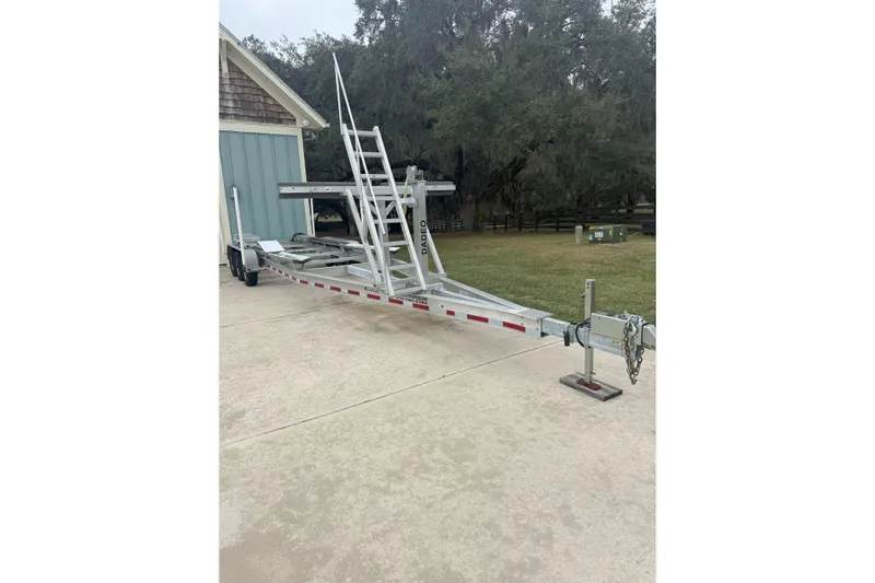 World Cat 296 Dc Yacht Photos Pics Boat trailer parked on driveway, designed for 2020 World Cat 296 DC model.