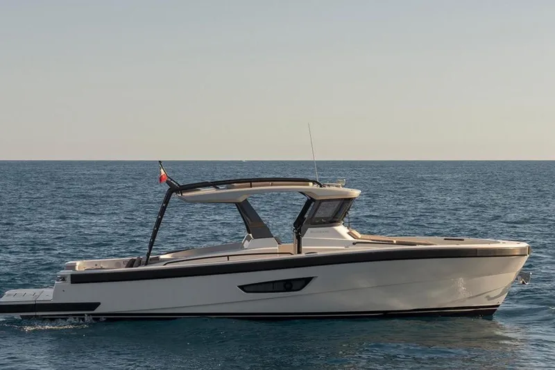  Yacht Photos Pics 2021 Bluegame BG42 yacht cruising on open sea under clear sky.