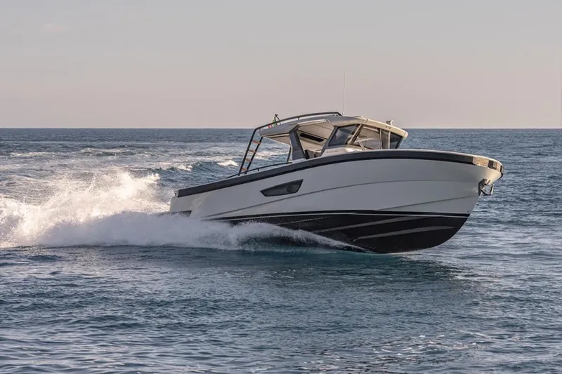  Yacht Photos Pics 2021 Bluegame BG42 yacht cruising on open sea, showcasing sleek design and performance.