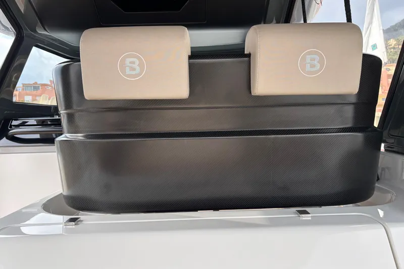  Yacht Photos Pics 2021 Bluegame BG42 yacht interior with sleek black seating and beige headrests.