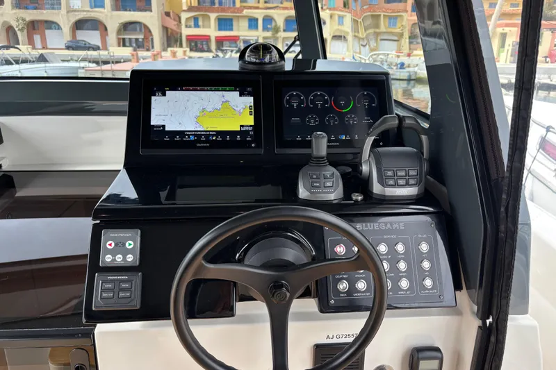  Yacht Photos Pics 2021 Bluegame BG42 yacht helm with navigation screens and controls.