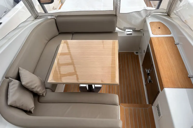  Yacht Photos Pics Luxurious interior of 2021 Bluegame BG42 yacht with elegant seating and wooden table.