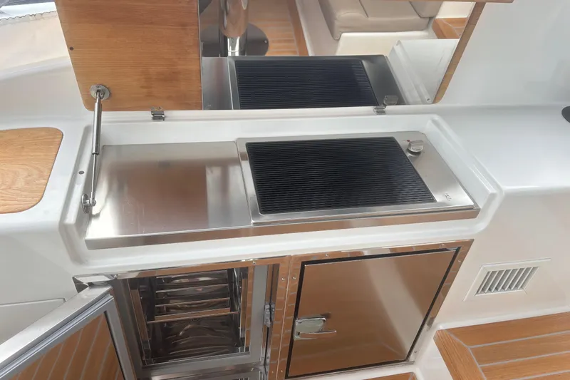  Yacht Photos Pics Outdoor kitchen on 2021 Bluegame BG42 yacht with stainless steel grill and storage.