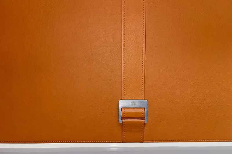  Yacht Photos Pics Orange leather detail with metal buckle on 2021 Bluegame BG42 yacht interior.
