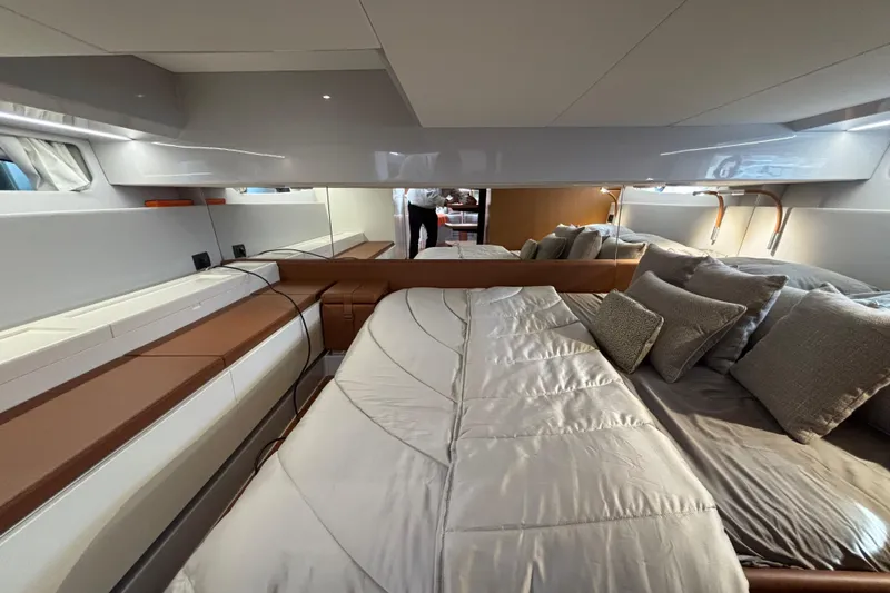  Yacht Photos Pics Luxurious interior of 2021 Bluegame BG42 yacht with elegant bedding and modern design.