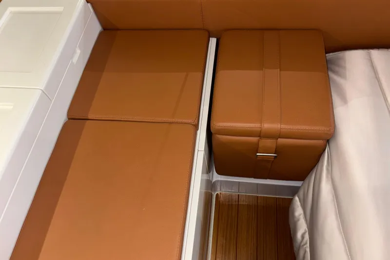  Yacht Photos Pics Luxurious interior seating of 2021 Bluegame BG42 yacht with brown leather upholstery.