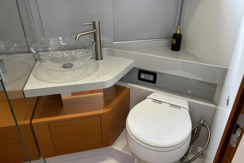  Yacht Photos Pics Modern bathroom in 2021 Bluegame BG42 yacht with glass sink and sleek fixtures.