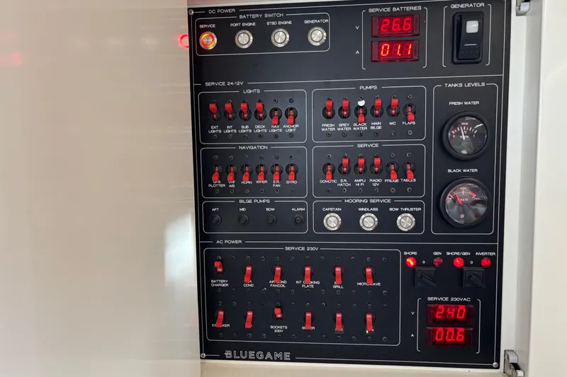 Yacht Photos Pics Control panel of a 2021 Bluegame BG42 yacht, featuring switches and gauges.
