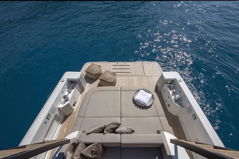  Yacht Photos Pics Luxurious 2021 Bluegame BG42 yacht deck with sun loungers and ocean view.