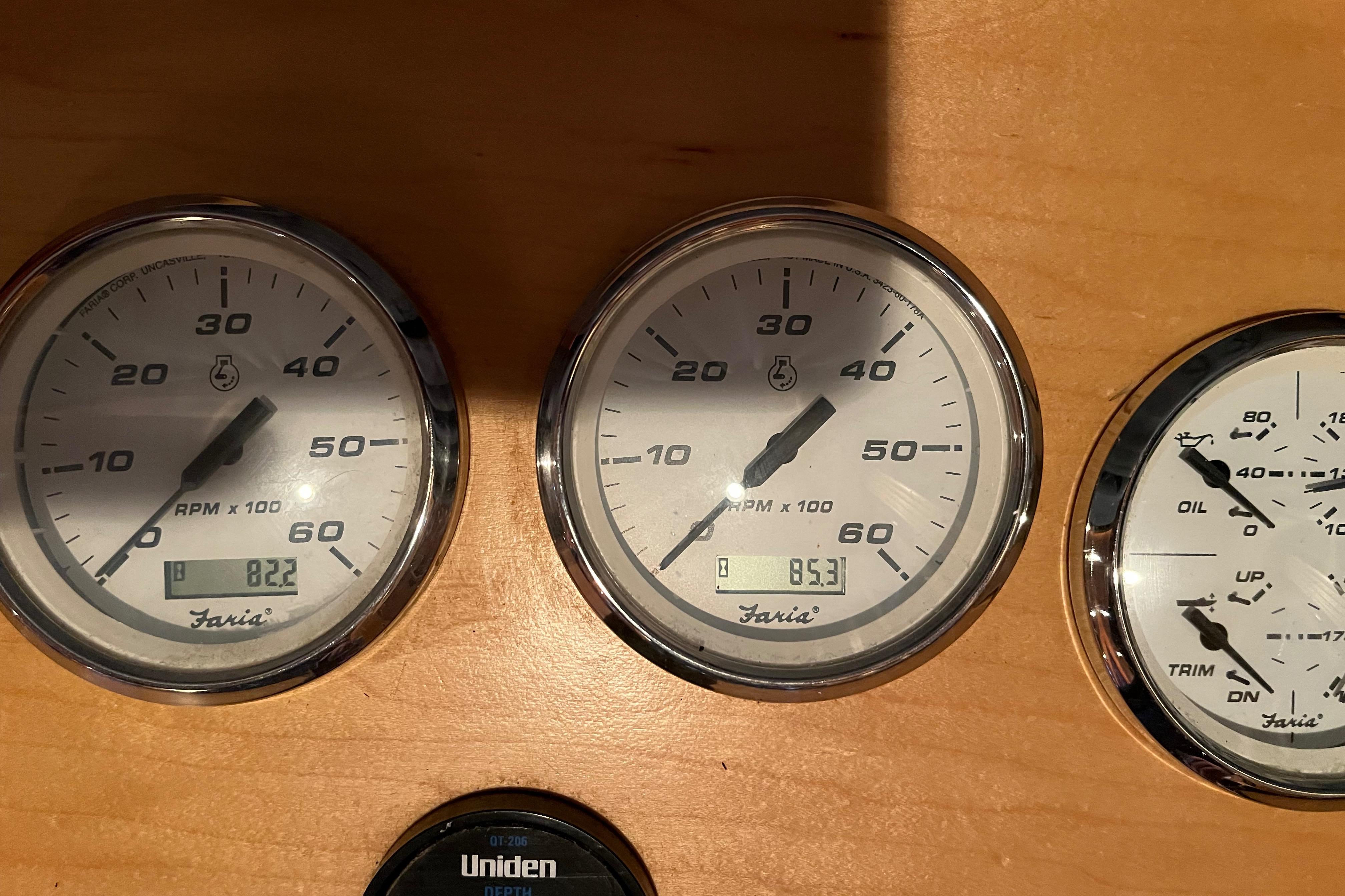 Close-up of Funtime 68x16 2010 boat gauges displaying RPM and oil levels.