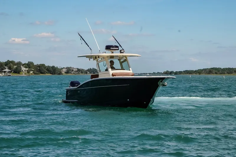  Yacht Photos Pics 2017 Scout 300 LXF boat cruising on a sunny day.
