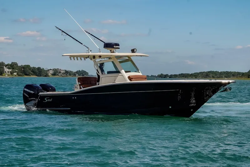  Yacht Photos Pics 2017 Scout 300 LXF boat cruising on clear blue water.