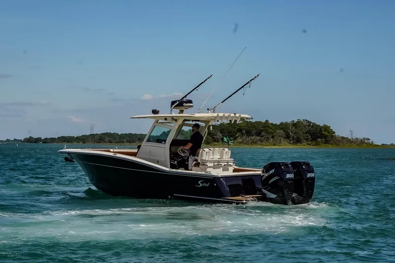  Yacht Photos Pics 2017 Scout 300 LXF boat cruising on a sunny day with dual engines.