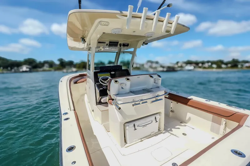  Yacht Photos Pics 2017 Scout 300 LXF boat on water, featuring sleek design and spacious deck.