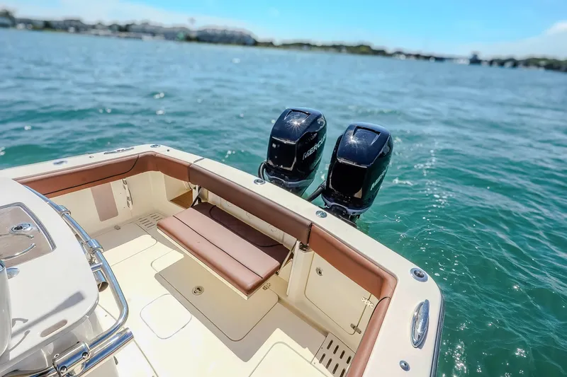  Yacht Photos Pics 2017 Scout 300 LXF boat with dual Mercury engines on open water.