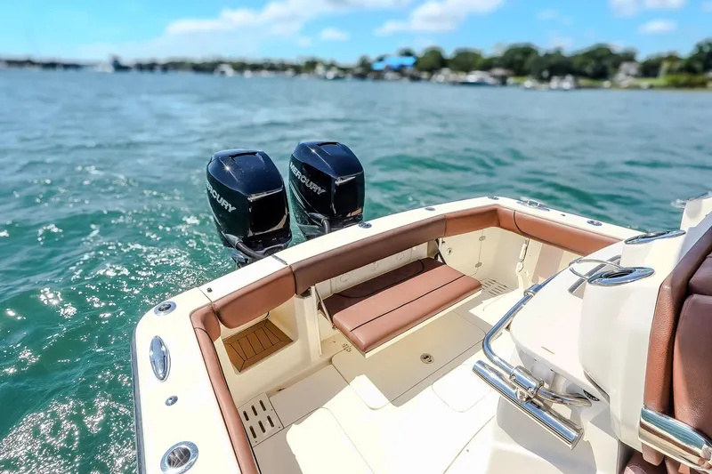  Yacht Photos Pics 2017 Scout 300 LXF boat with dual Mercury engines on a sunny day.