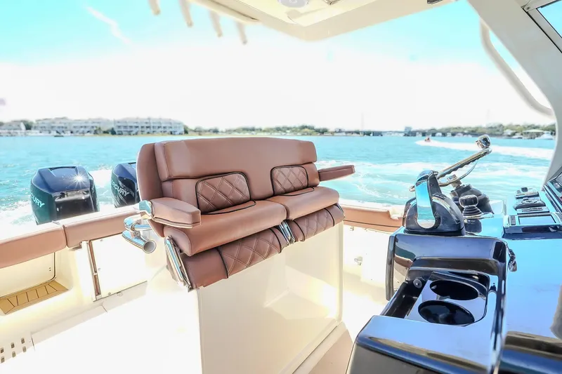  Yacht Photos Pics Luxurious interior of 2017 Scout 300 LXF boat with leather seating and dual Mercury engines.