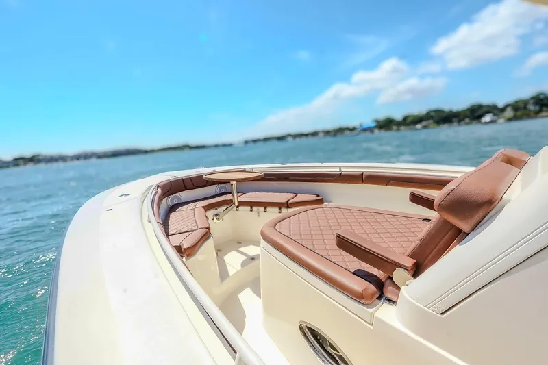 Yacht Photos Pics 2017 Scout 300 LXF boat interior with luxurious seating on a sunny day.