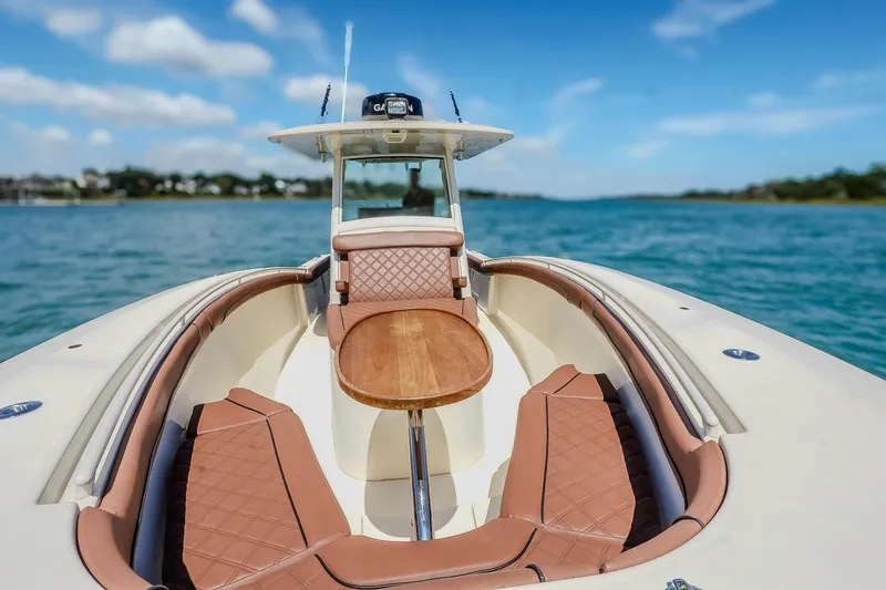  Yacht Photos Pics 2017 Scout 300 LXF boat with luxurious seating on a sunny day.