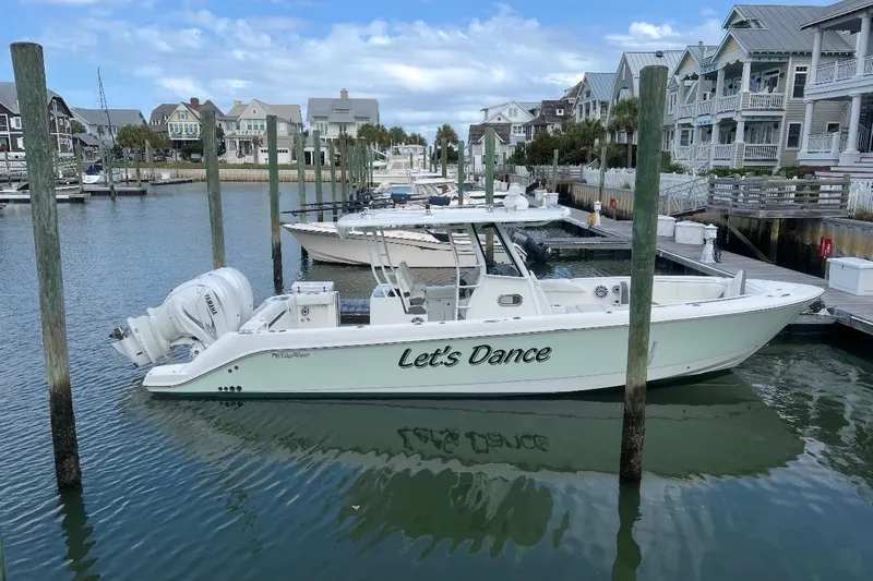 Let's Dance Yacht Photos Pics 2020 Edgewater 340CC boat named "Let's Dance" docked in a marina.