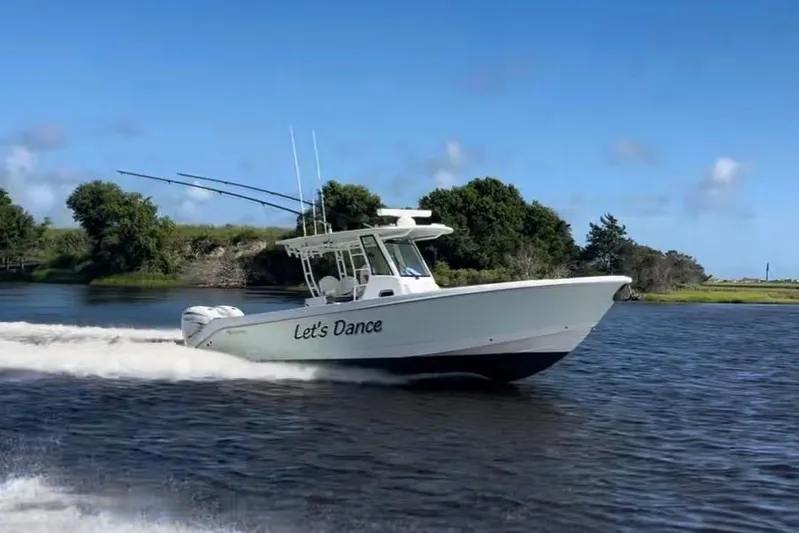 Let's Dance Yacht Photos Pics Edgewater 340CC 2020 boat named "Let's Dance" cruising on a scenic river.