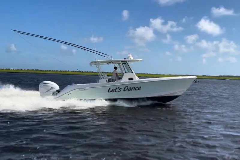 Let's Dance Yacht Photos Pics 2020 Edgewater 340CC boat named "Let's Dance" cruising on open water.