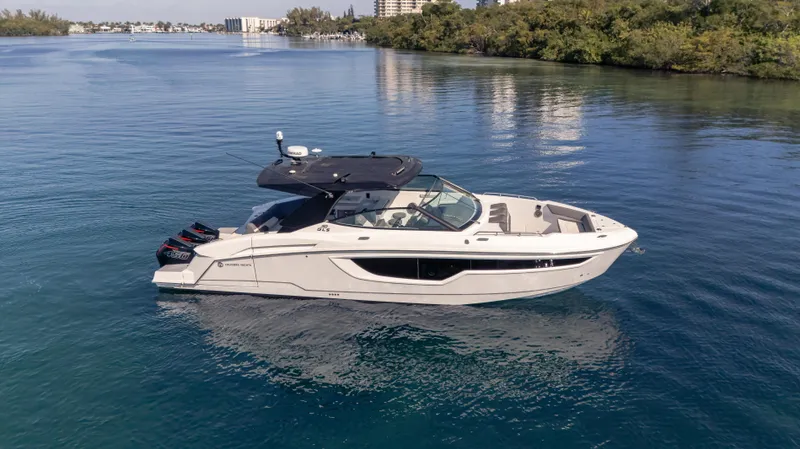  Yacht Photos Pics 2021 Cruisers Yachts 38 GLS OB 450R on calm water, side view.