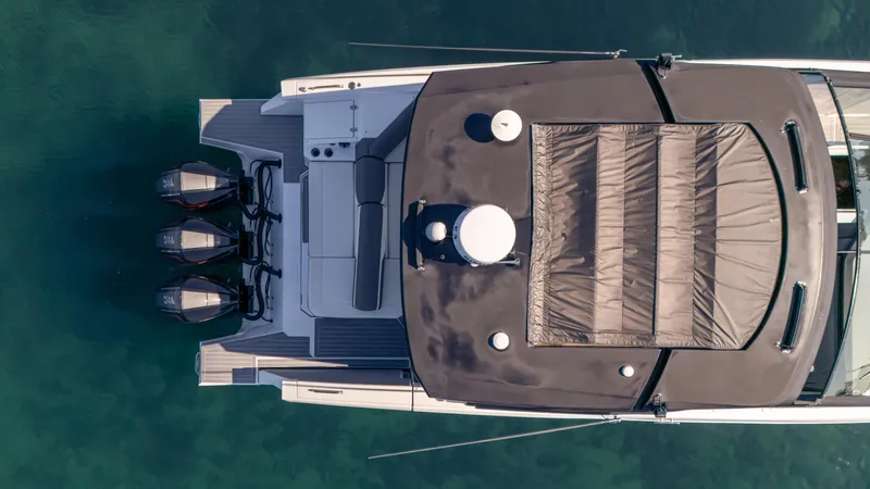  Yacht Photos Pics Top view of 2021 Cruisers Yachts 38 GLS OB 450R on clear water.