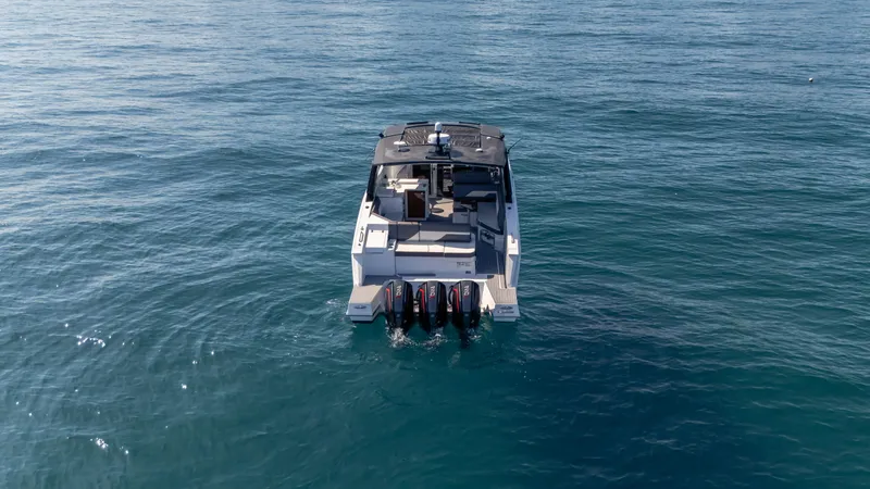  Yacht Photos Pics 2021 Cruisers Yachts 38 GLS OB 450R on open water, rear view.