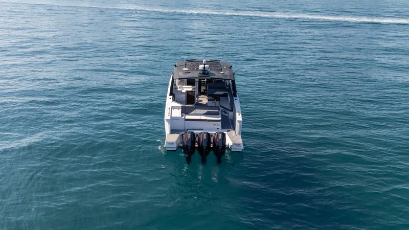  Yacht Photos Pics 2021 Cruisers Yachts 38 GLS OB 450R on open water, rear view.