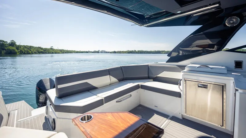  Yacht Photos Pics Luxurious 2021 Cruisers Yachts 38 GLS OB 450R with sleek seating and scenic water view.