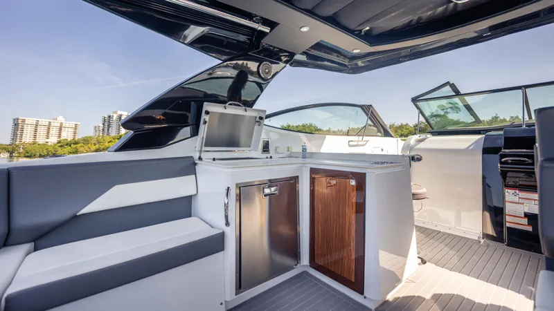  Yacht Photos Pics 2021 Cruisers Yachts 38 GLS OB 450R interior with modern seating and kitchenette.