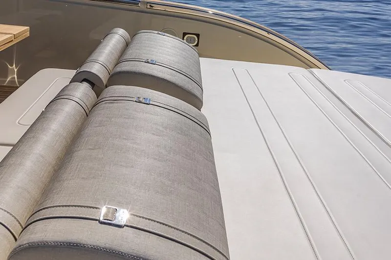  Yacht Photos Pics 2024 Invictus TT460 yacht with luxurious sunbathing area and elegant upholstery.