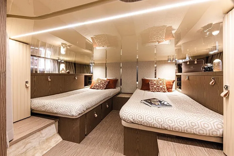  Yacht Photos Pics 2024 Invictus TT460 yacht interior with twin beds, modern design, and elegant decor.