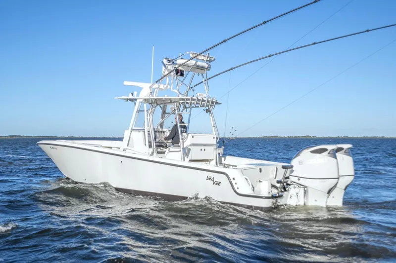  Yacht Photos Pics 2012 SeaVee 340B boat cruising on open water under clear blue skies.