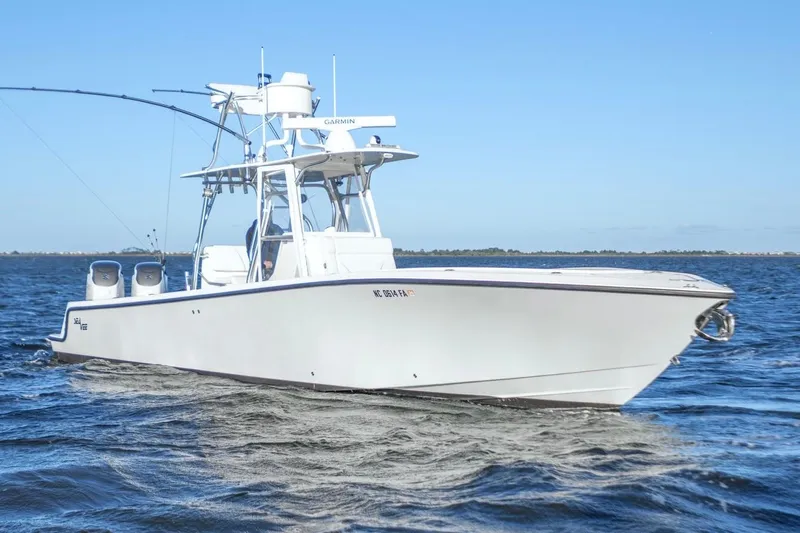  Yacht Photos Pics 2012 SeaVee 340B boat cruising on open water under clear blue skies.