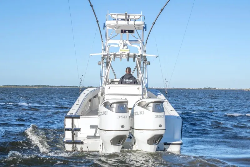  Yacht Photos Pics 2012 SeaVee 340B boat with dual Suzuki 350 engines cruising on open water.